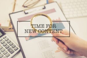 Picture of clipboard with paperwork overlaid with text, "Time for New Content"
